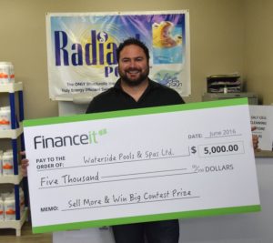 Sell More Win Big winner holding up a big cheque